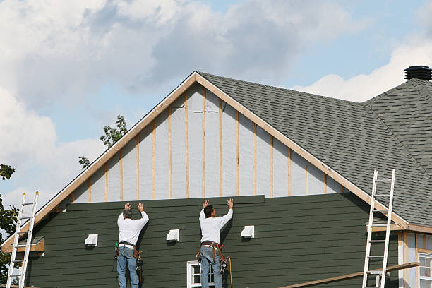 Professional Storm Damage Siding Repair technician working in Midland, NC